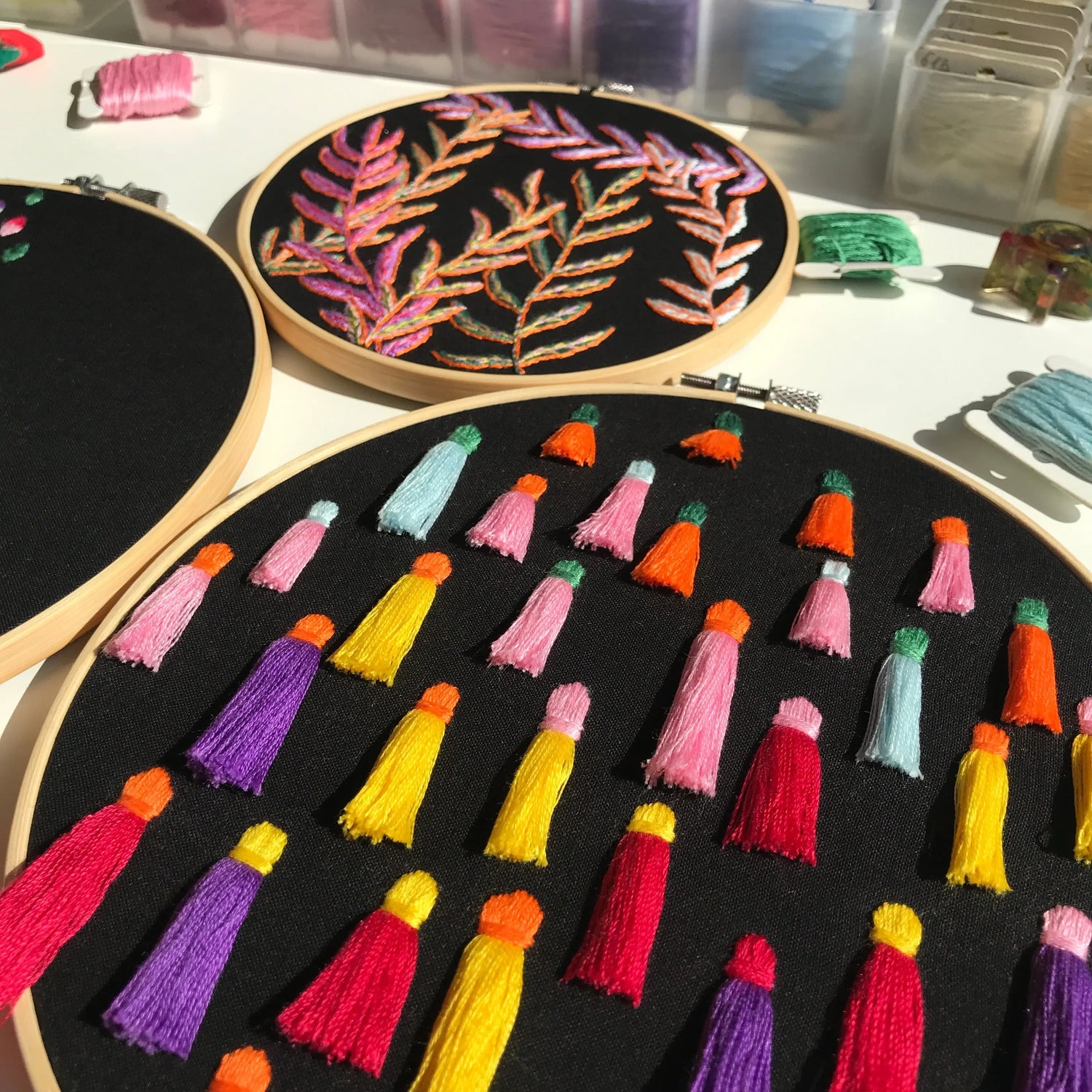 Modern abstract embroidery design with geometric shapes and colorful thread work