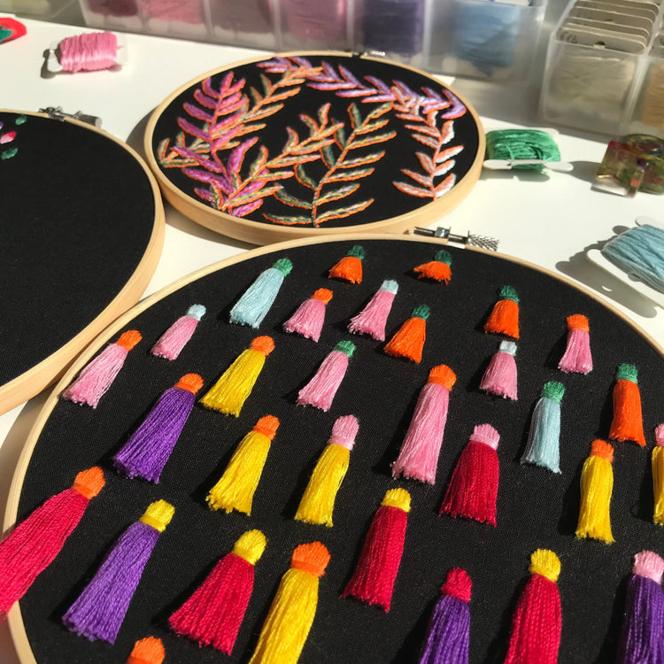 Modern abstract embroidery design with geometric shapes and colorful thread work