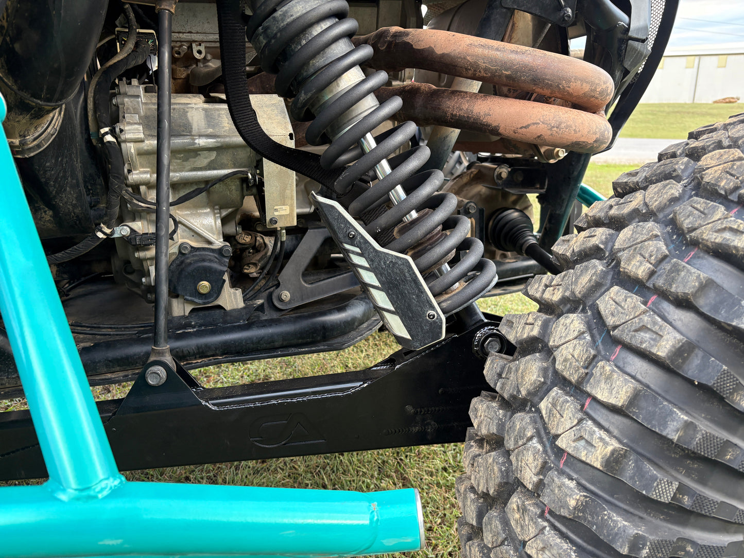 Embroidery hoop with embroidered horses on a light fabric background