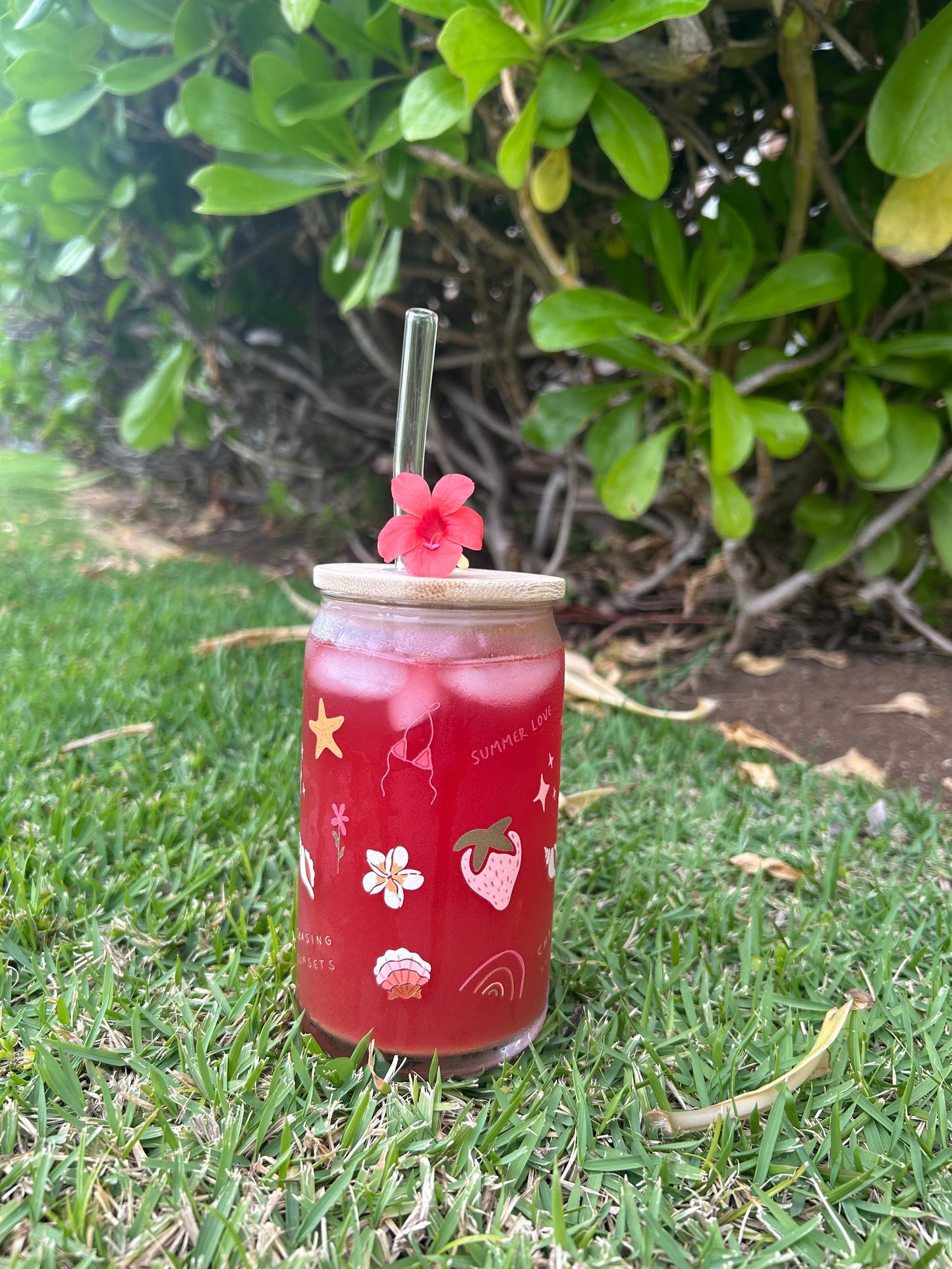 Hand holding a miniature stumpwork carousel in progress with horses on a dark surface